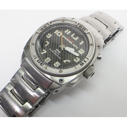 60 - A MTM Special Ops quartz military style bracelet watch, stainless steel with a carbon fibre dial.  4... 