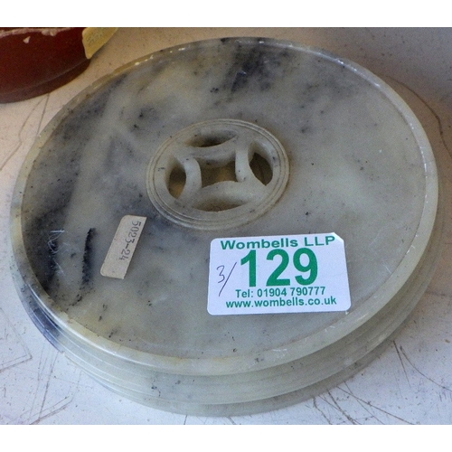 129 - An Oriental carved and polished stone base together with a pair of Oriental glass bonsai trees in te... 