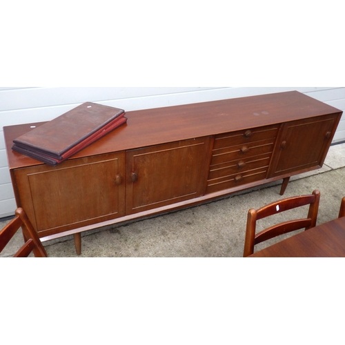 640 - A teak sideboard, 223cm long, together with a table and four chairs, chairs with label Scandart, Hig... 