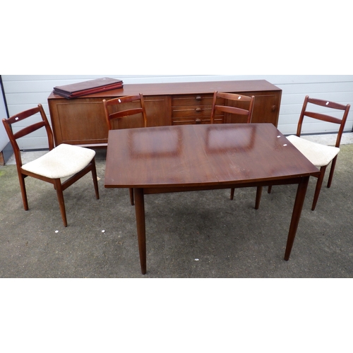640 - A teak sideboard, 223cm long, together with a table and four chairs, chairs with label Scandart, Hig... 