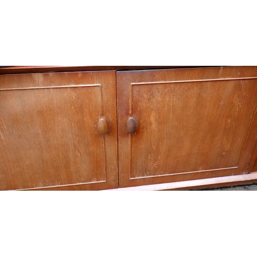 640 - A teak sideboard, 223cm long, together with a table and four chairs, chairs with label Scandart, Hig... 