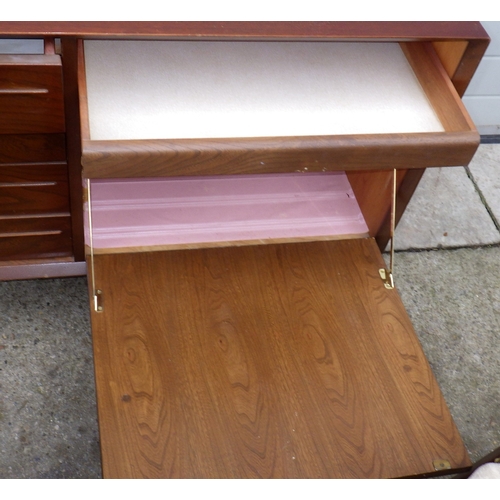 640 - A teak sideboard, 223cm long, together with a table and four chairs, chairs with label Scandart, Hig... 