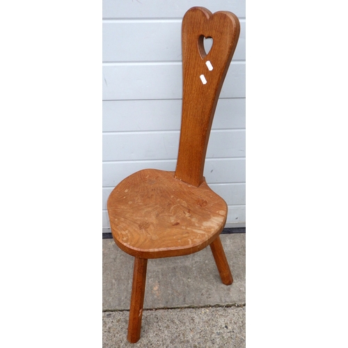 667 - A Lizard man oak spinning chair, water marks, 94cm tall