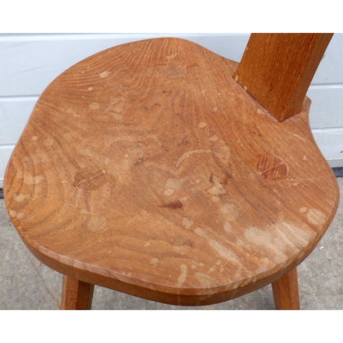 667 - A Lizard man oak spinning chair, water marks, 94cm tall