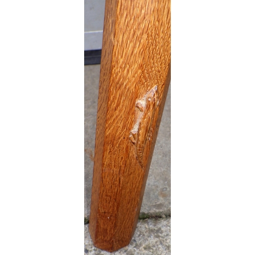 667 - A Lizard man oak spinning chair, water marks, 94cm tall