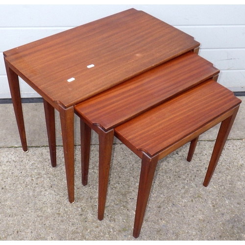 668 - A teak nest of three occasional tables