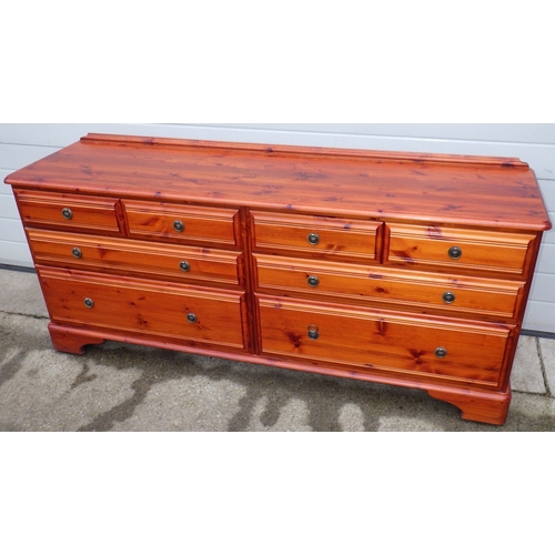 701 - A stained pine double chest of drawers, 170cm wide