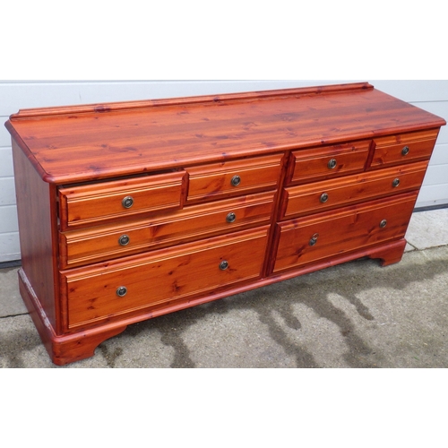 701 - A stained pine double chest of drawers, 170cm wide