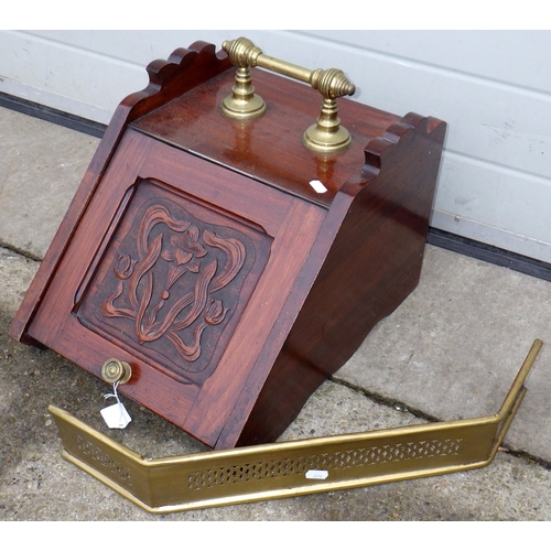 712 - A Victorian walnut coal scuttle, missing shovel together with a small pierced brass fender (2)