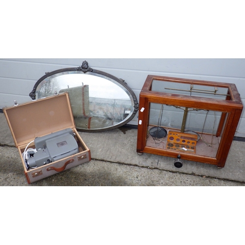 713 - An oval wall mirror, balance scales, missing glass and an Agfa projector (3)