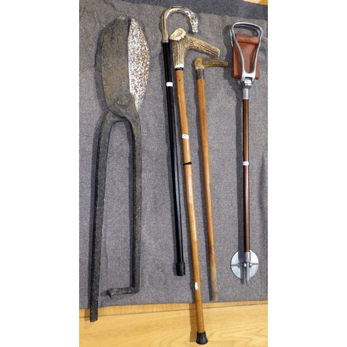 714 - A large pair of tin snips, shooting stick, two horn handled sticks and another walking stick with ho... 
