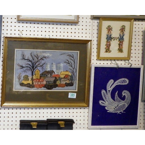 385 - A group of seven needlework pictures (7)