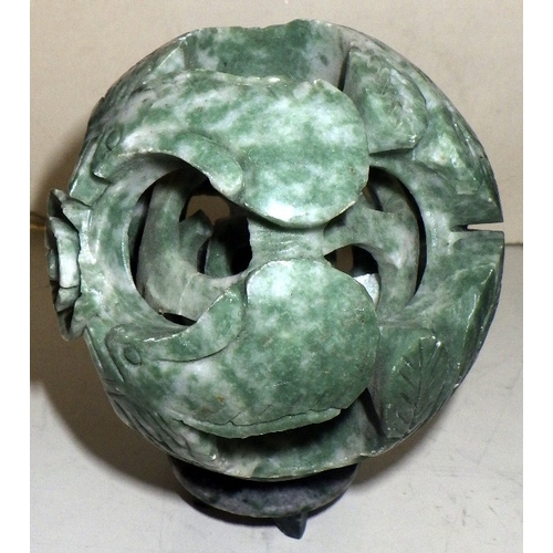 373 - An oriental barrel shaped tea pot AF together with a polished stone puzzle ball and a sculpture (3)