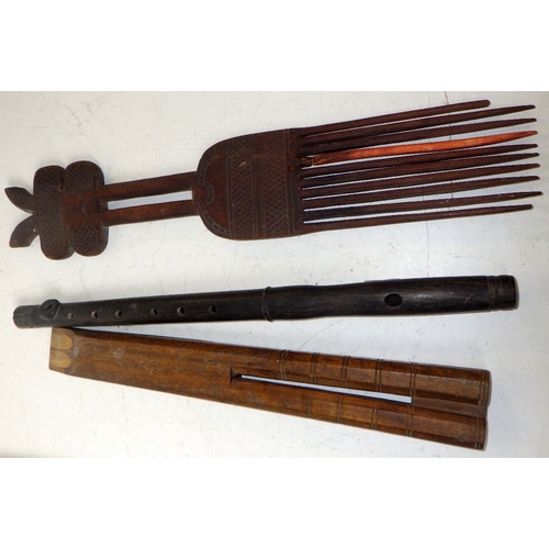422 - An African comb, unusual horn shaped artefact, flutes etc
