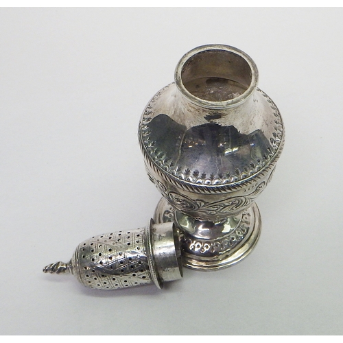 25 - A silver repousse caster, hallmarks rubbed.  Approx 165mm tall / 130g