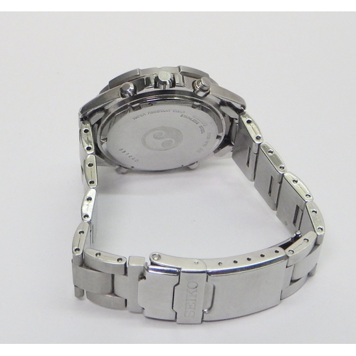 56 - A Seiko Quartz Alarm Chronograph bracelet watch 7T32-7F70, comprising a quartz movement under a yell... 