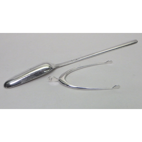 68 - A silver wishbone novelty sugar tongs, early 20th cent; a silver marrow scoop, 20th cent.  Tongs app... 