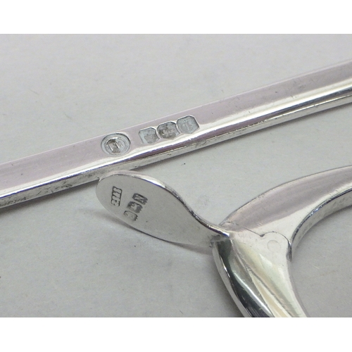68 - A silver wishbone novelty sugar tongs, early 20th cent; a silver marrow scoop, 20th cent.  Tongs app... 