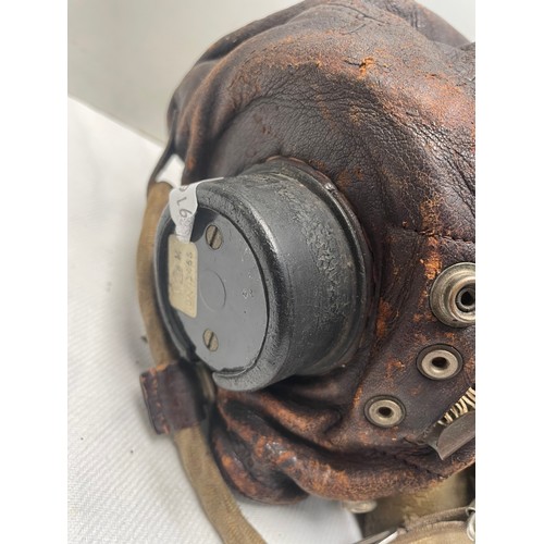 91A - An RAF type C late pattern flying helmet together with a type H oxygen mask having Korean War-era is... 