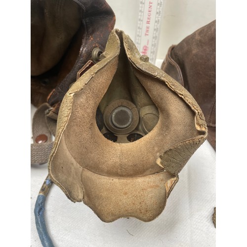 91A - An RAF type C late pattern flying helmet together with a type H oxygen mask having Korean War-era is... 