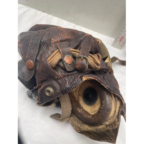 91A - An RAF type C late pattern flying helmet together with a type H oxygen mask having Korean War-era is... 