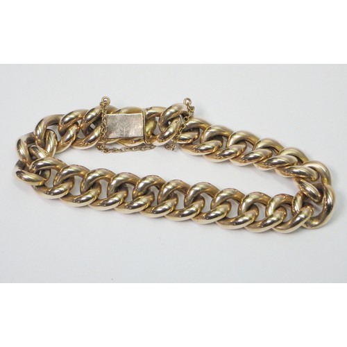 41A - A curb chain bracelet, yellow metal marked 15ct. Presented in a period fitted case 