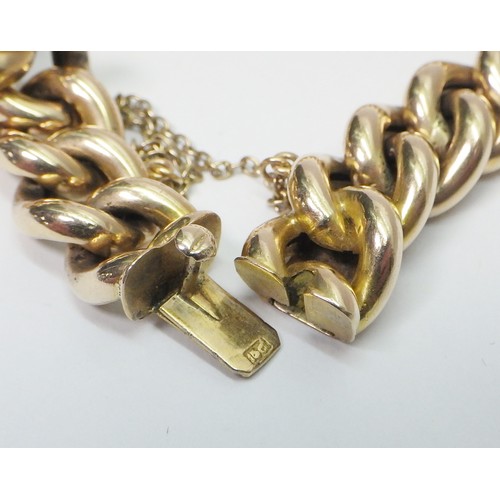 41A - A curb chain bracelet, yellow metal marked 15ct. Presented in a period fitted case 