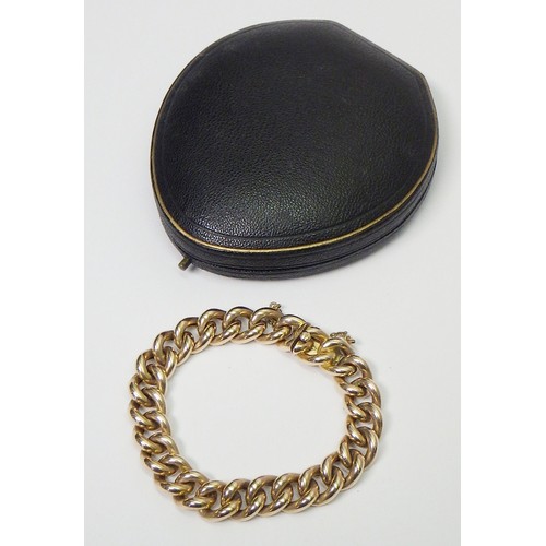 41A - A curb chain bracelet, yellow metal marked 15ct. Presented in a period fitted case 