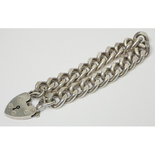 45A - A silver curb link chain bracelet, late 20th cent.  Chain approx 170mm long / 11mm wide / 55g