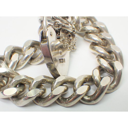 45A - A silver curb link chain bracelet, late 20th cent.  Chain approx 170mm long / 11mm wide / 55g