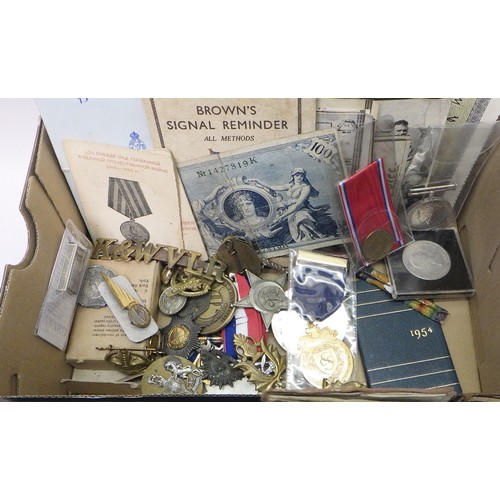 96 - Militaria to include Soldier's Record and Pay Book 1940s / 1950s; badges; identity tags; a WW2 servi... 