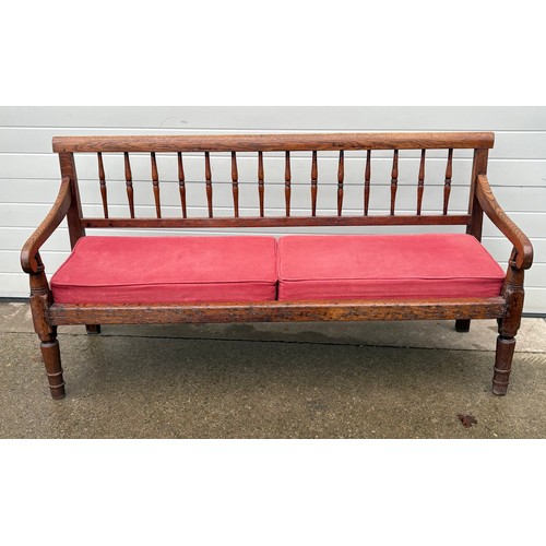 A 19th century oak spindle back bench, 182cm long