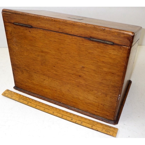 10 - An early 20thC oak stationery box, small piece of moulding missing