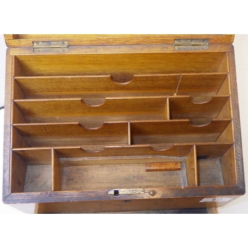 10 - An early 20thC oak stationery box, small piece of moulding missing