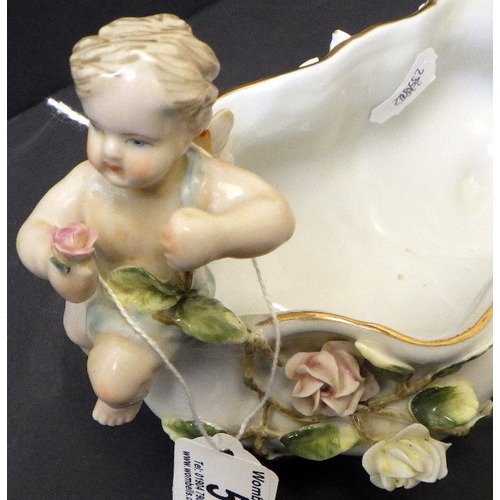 5 - A Meissen bowl decorated with Cherubs, 15cm tall 23cm wide