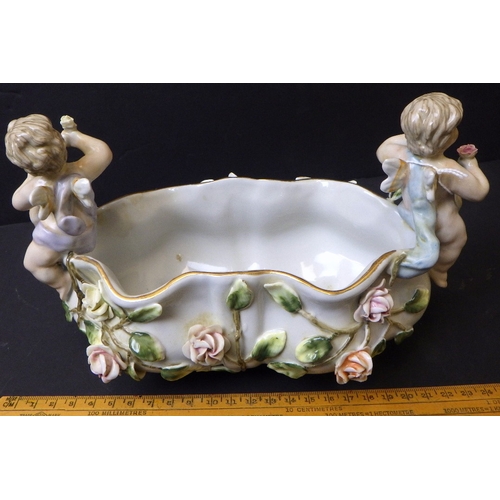 5 - A Meissen bowl decorated with Cherubs, 15cm tall 23cm wide