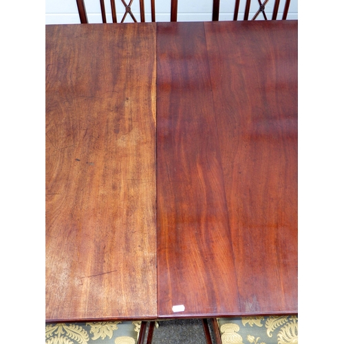 642 - A mahogany twin pillar dining table with one leaf, 226cm long x 107cm, together with a set of seven ... 