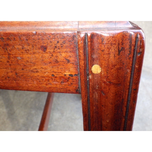 642 - A mahogany twin pillar dining table with one leaf, 226cm long x 107cm, together with a set of seven ... 