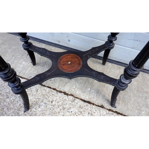 689 - A 19th cen ebonised side table with ceramic panel depicting a rural scene, missing lower finial, 57c... 