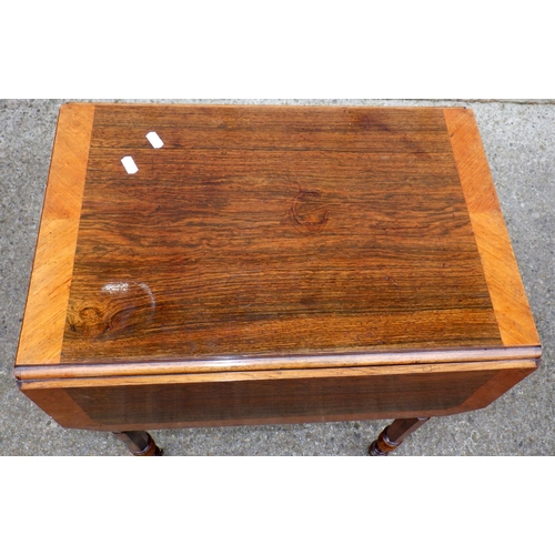 705 - A 19th cen rosewood drop leaf work table, marks, 55cm long
