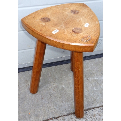 A Fish motif adzed oak milking stool
