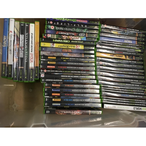 2323 - A box containing a collection of Xbox games and cheat books