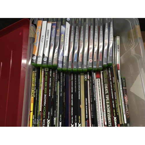 2323 - A box containing a collection of Xbox games and cheat books