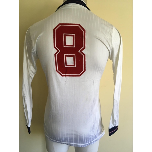 4 - 1985 Ray Wilkins Match Worn England Football Shirt: Long sleeve white Umbro number 8 shirt. Worn in ... 