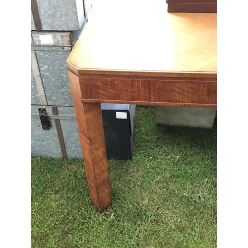 189 - An Art Deco walnut dining table with an internal extra leaf 130x84cm