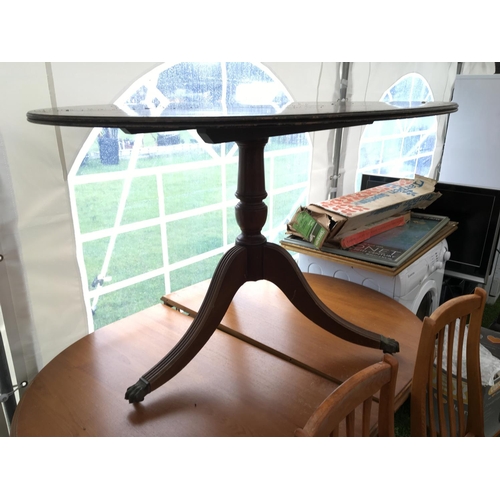 251 - A modern dining table with a set of four chairs and one other mahogany table.