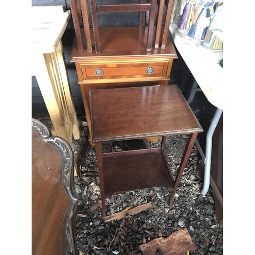 26 - A nest of three mahogany occasional tables a modern Yew wood cabinet and one other table (3)