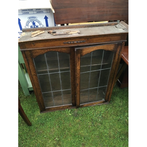 270 - An oak bookcase a walnut commode with a hinged top and an Ercol type kitchen table (3)