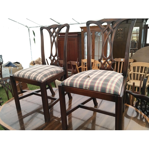 277 - A Mahogany dining table with a satinwood banded edge and a set of Eight George III style chairs with... 