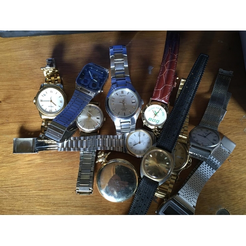 53 - A collection of gents watches commemorative coins and some bank notes